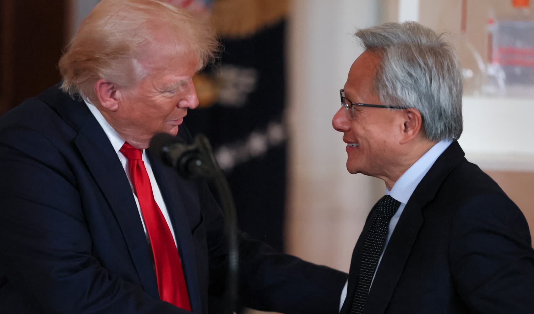 NVIDIA CEO Jensen Huang and U.S. President Donald Trump shake hands at an ‘Investing in America’ event in Washington, D.C., U.S., April 30, 2025.