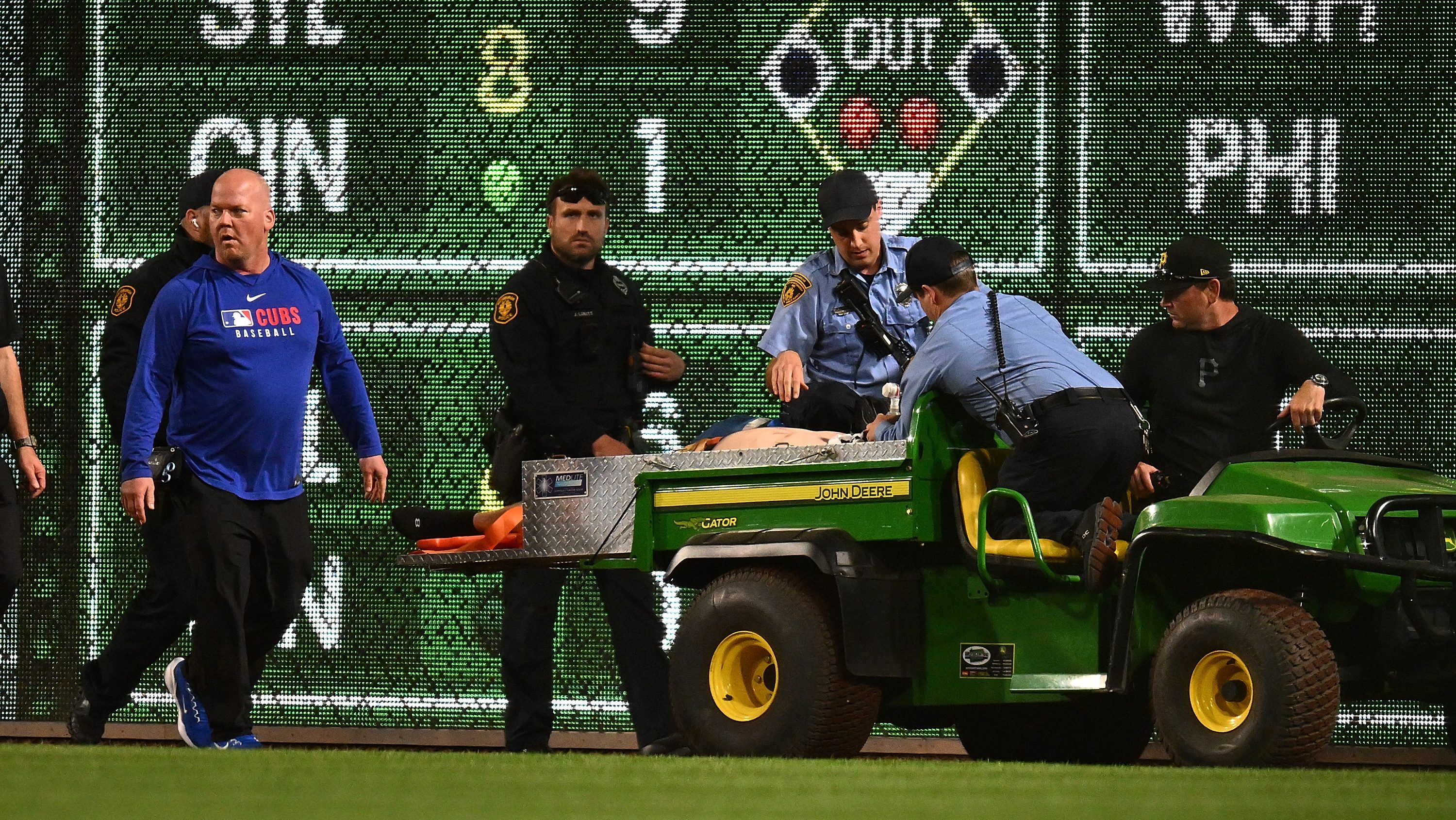 A fan is carted off the field after falling from the stands during the seventh inning of the game between the Chicago Cubs and the Pittsburgh Pirates at PNC Park on April 30, 2025 in Pittsburgh, Pennsylvania.