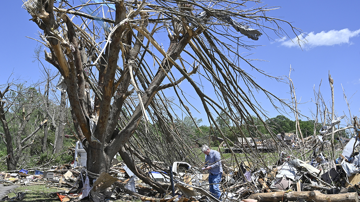 Dennis Clark goes through the remains of his house that was destroyed by severe weather in London, Ky., Saturday, May 17, 2025.